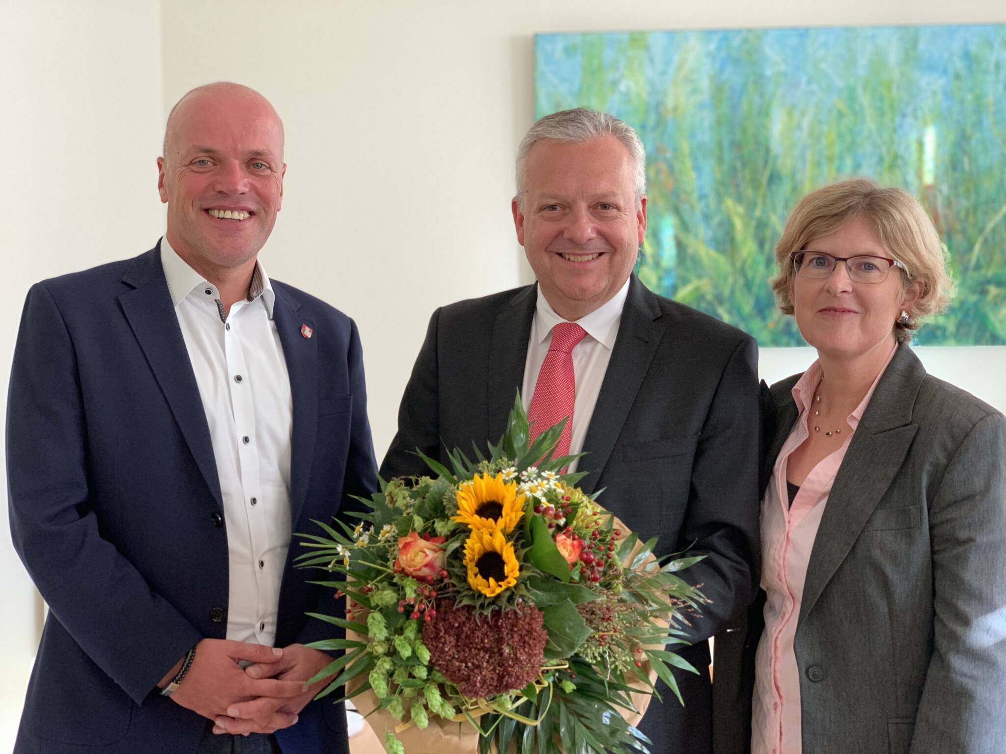 Bürgermeister Klaus Krützen und Arno Jansen mit seiner Frau Andrea.